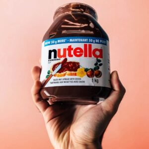 person holding Nutella jar