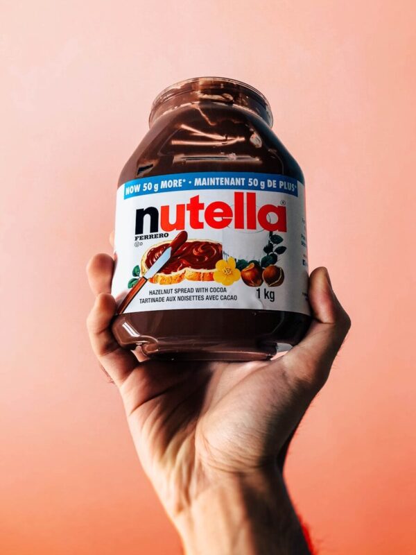 Photo by Chris Liverani person holding Nutella jar